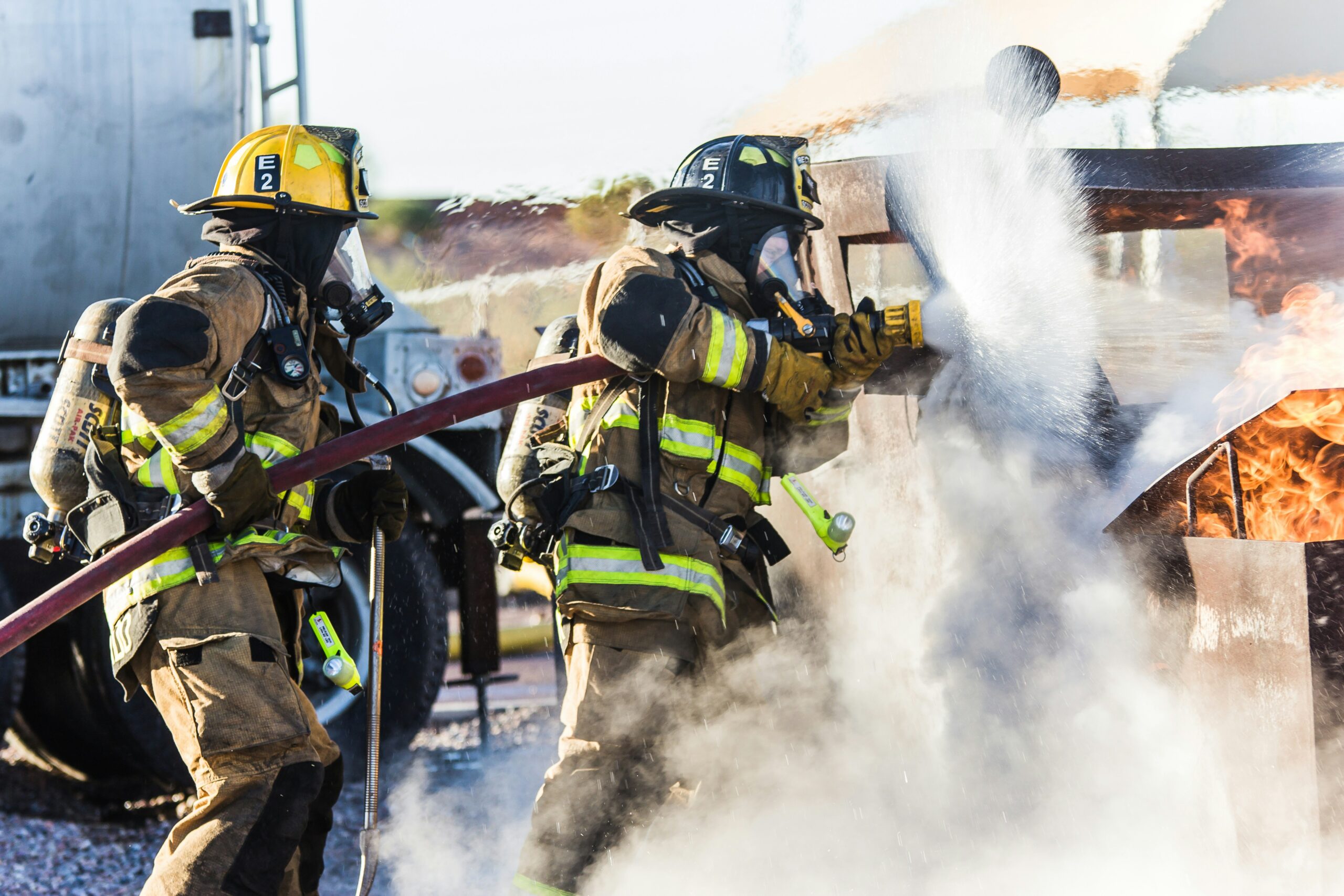 A building inspector conducting hands-on testing on a ventilation fire damper rig during a City & Guilds accredited Fire & Smoke Damper Testing Course.