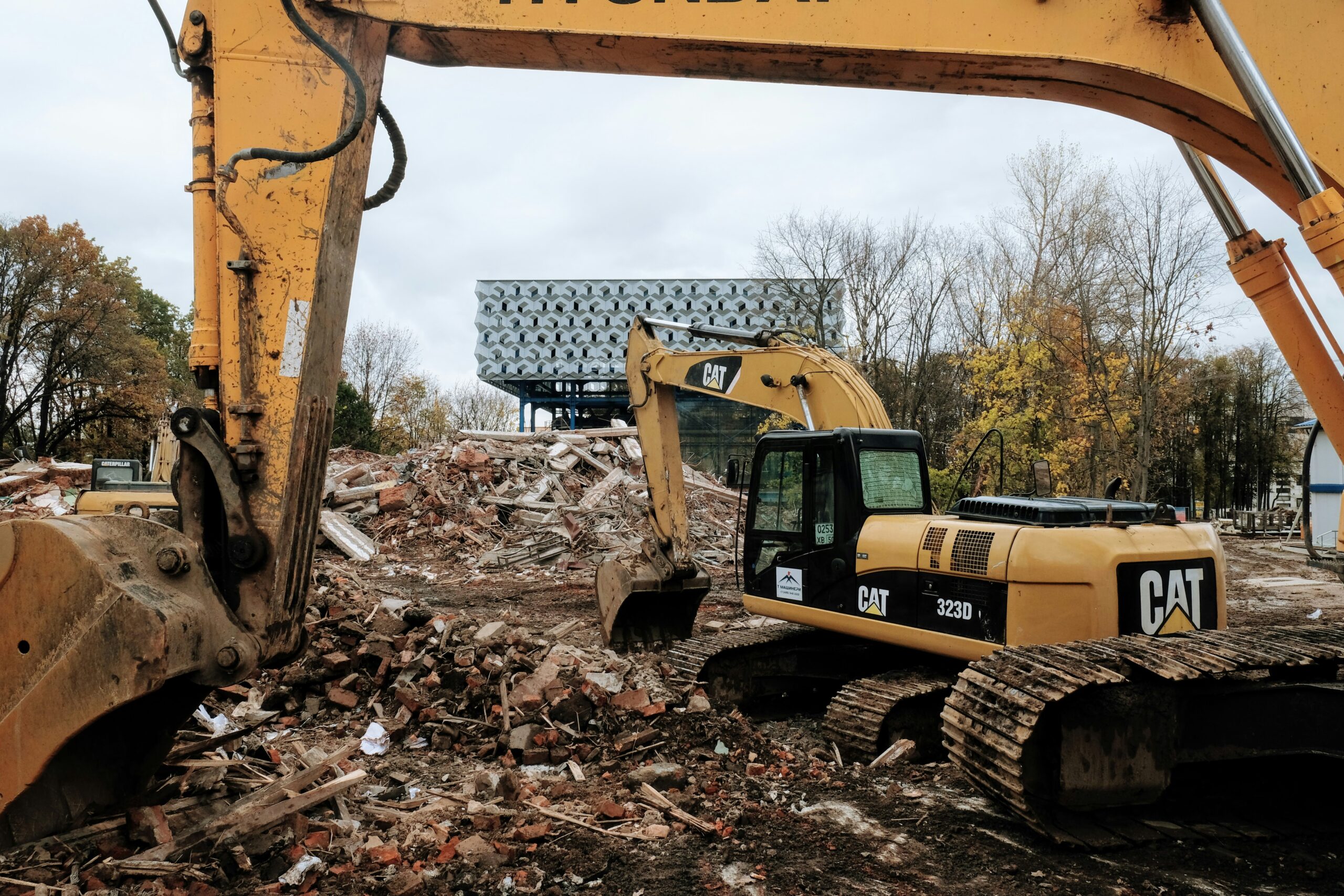 A qualified demolition operative working safely on a UK construction site to achieve a recognized skilled trade qualification.