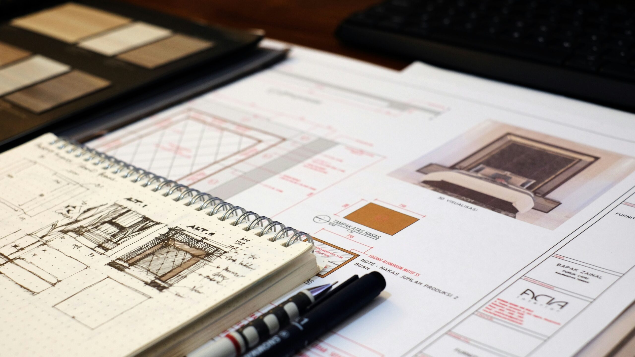 An experienced kitchen installer mounting wall cabinets to earn a professional fitted interiors qualification.