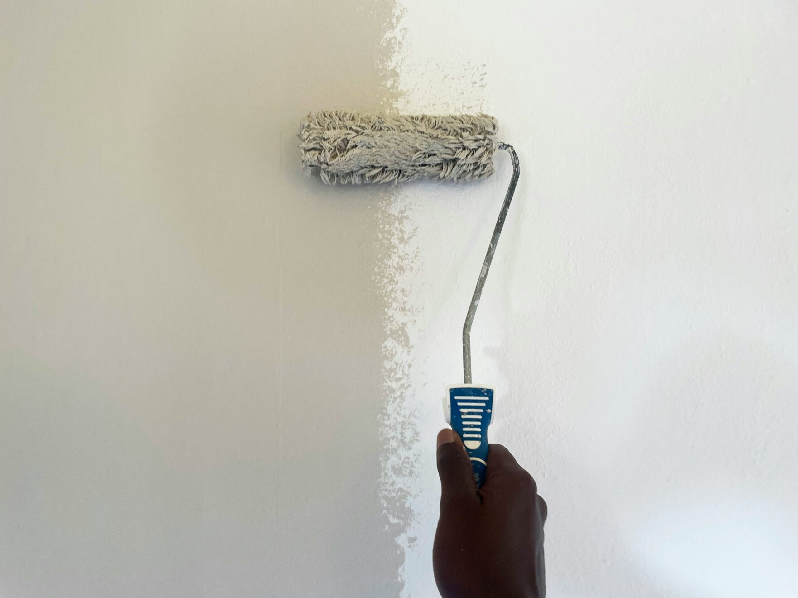A qualified professional completing a commercial decorating and painting project to high industry standards.