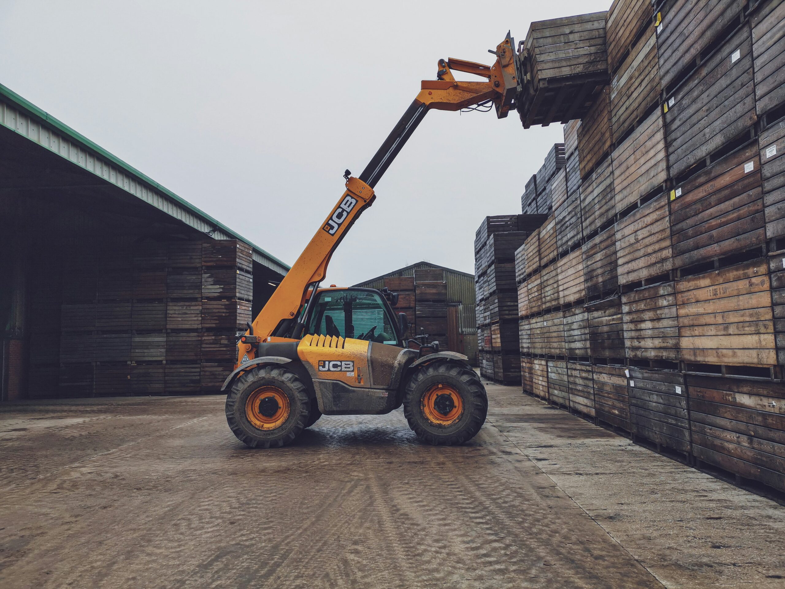 A professional construction operator completing a practical assessment for the CPCS NVQ Telehandler qualification.